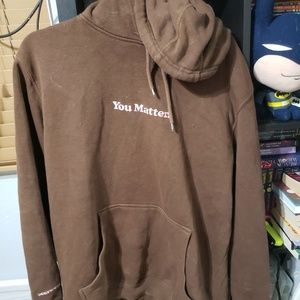 Brown you matter hoodie with pink lettering